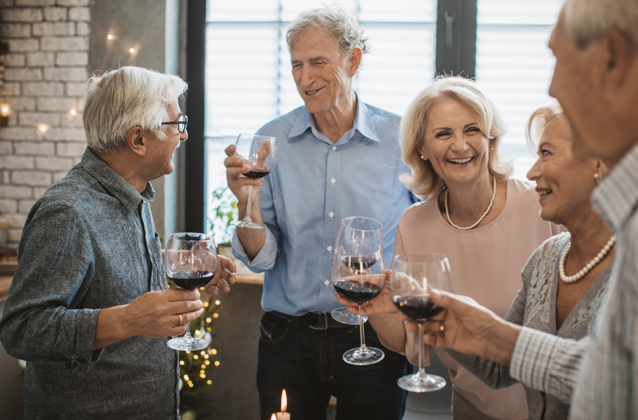 Senior friends having dinner for Christmas evening